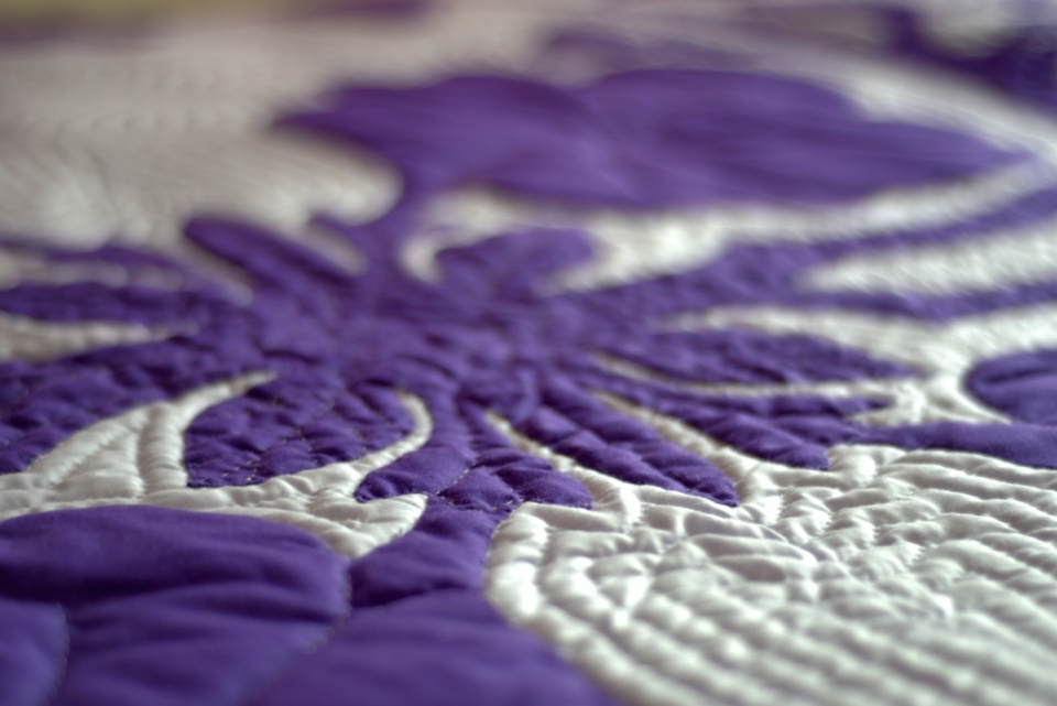 紫色布料精致花纹装饰作品摆拍