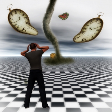 男子站在黑白格子上抱头面对龙卷风和扭曲的时钟