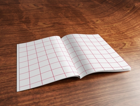 室内木制桌面摊开红色网格笔记本