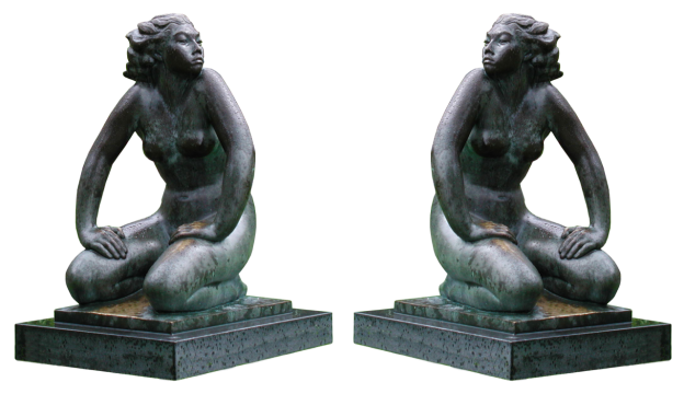 两尊下跪对视的大理石雕像