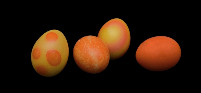 摄影入门教程_黑色背景复活节节日橙色彩蛋