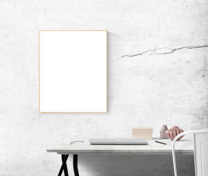 简约风格工作台笔记本电脑白色墙面裂纹和白画框