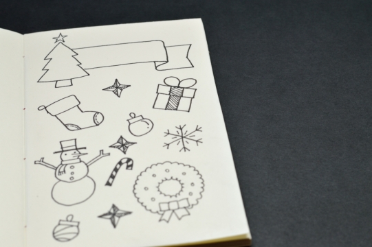 黑色桌面笔记本白色内页线描绘画