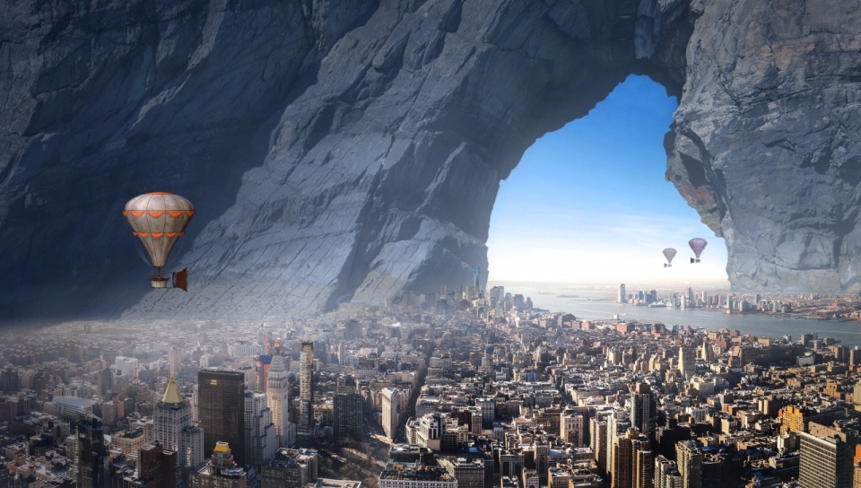 巨大山洞中的城市上空漂浮着热气球