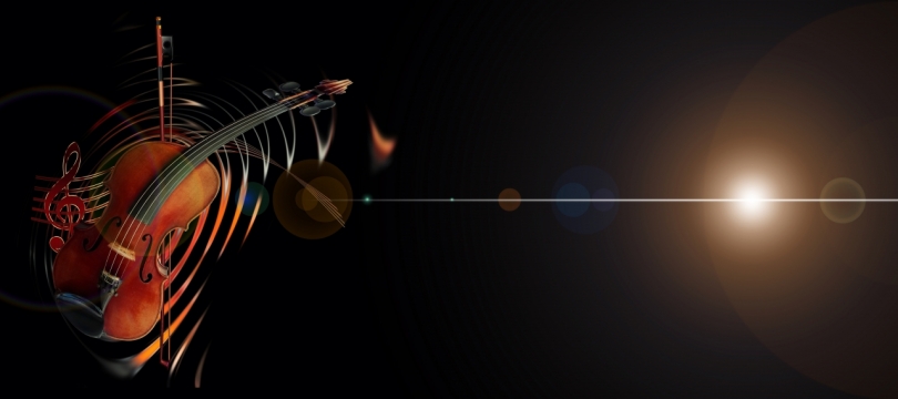 黑暗中白色光斑下小提琴特写